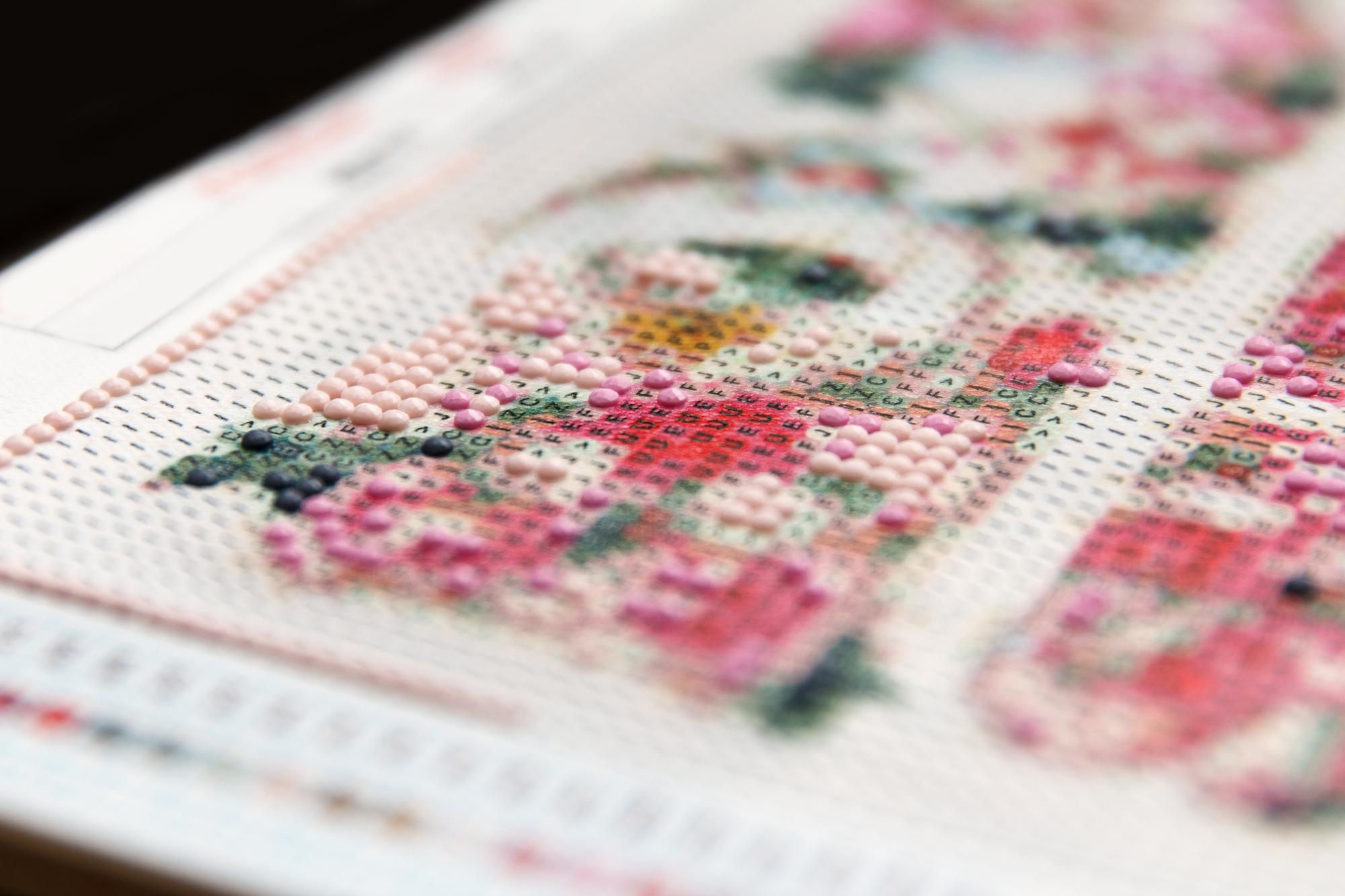 assorted embroidered swatches laid out on table